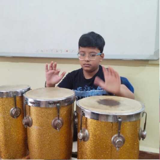 Student playing drums at Natraj Sangeet Center